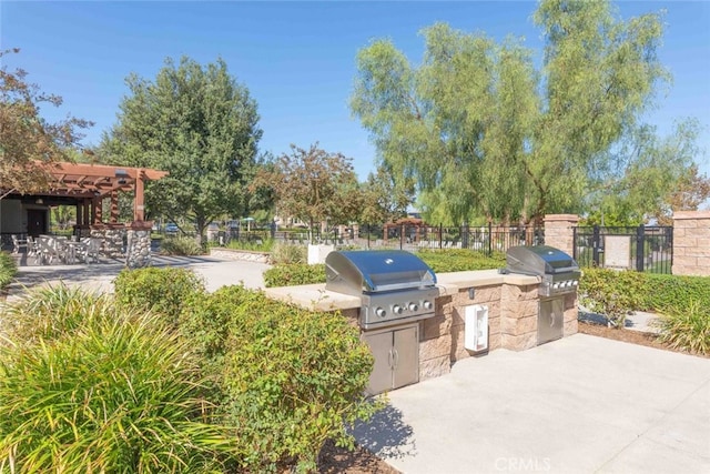 25499 Foxglove Ln, Corona, CA 92883 - view of patio / terrace with an outdoor kitchen, a pergola, fence, and a grill
