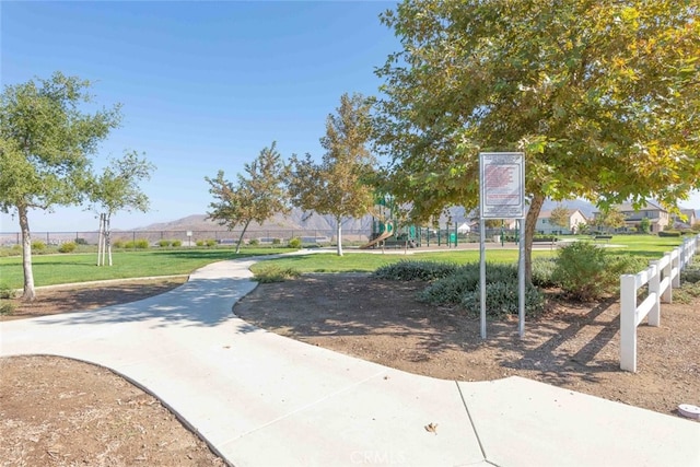 25499 Foxglove Ln, Corona, CA 92883 - view of community featuring fence, playground community, and a mountain view