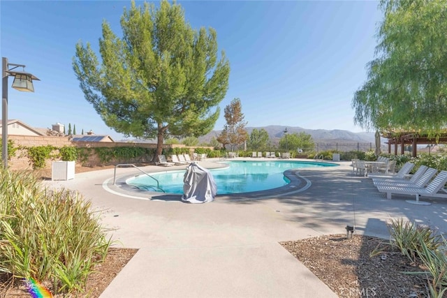 25499 Foxglove Ln, Corona, CA 92883 - pool featuring a mountain view, fence, and a patio area