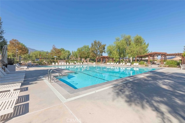 25499 Foxglove Ln, Corona, CA 92883 - pool featuring a pergola, a patio, fence, and a mountain view
