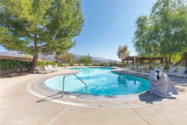 25499 Foxglove Ln, Corona, CA 92883 - community pool with fence, a mountain view, and a patio
