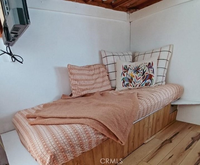 bedroom with wood finished floors