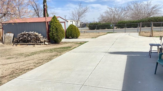 exterior space featuring fence and an outdoor structure