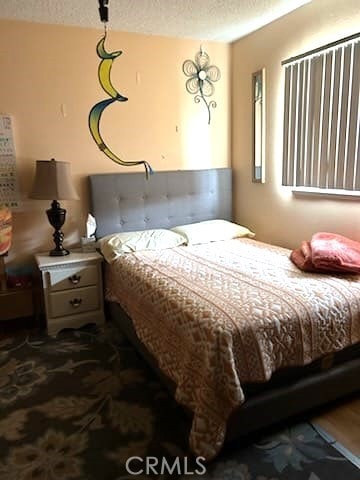 bedroom featuring a textured ceiling