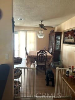 dining room with a ceiling fan and visible vents