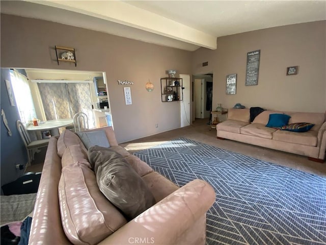 living room featuring vaulted ceiling with beams, carpet floors, and visible vents