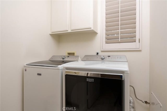 laundry room with cabinet space and independent washer and dryer