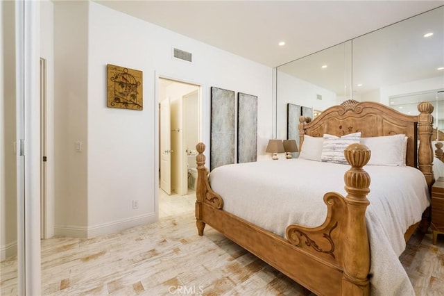 bedroom with light wood-style floors, baseboards, visible vents, and recessed lighting