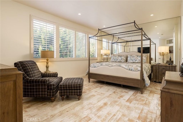 bedroom featuring wood finished floors and recessed lighting