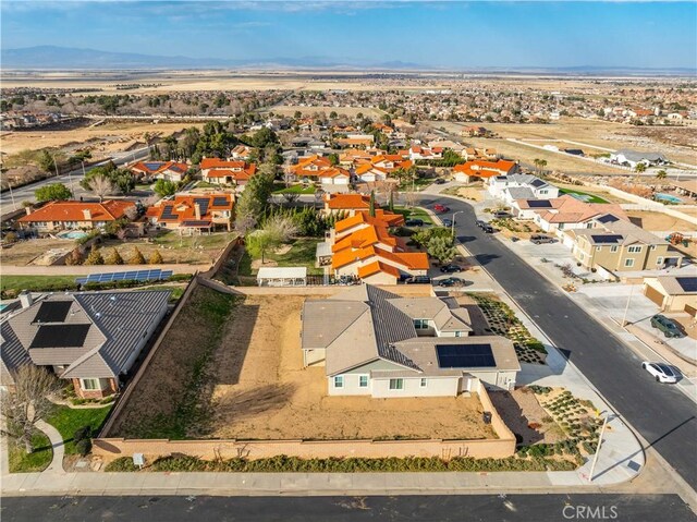 drone / aerial view featuring a mountain view and a residential view