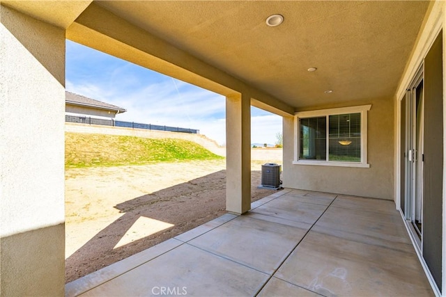 view of patio featuring cooling unit and a fenced backyard