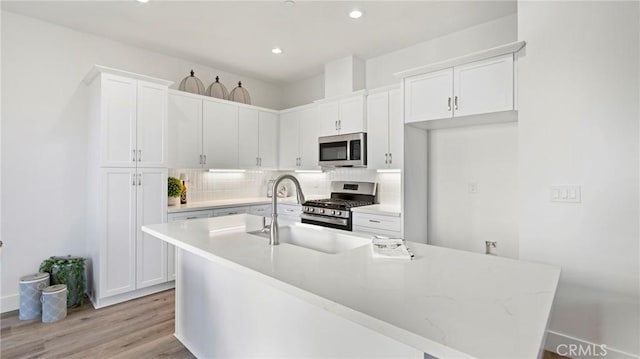 366 S Halcyon Rd, Arroyo Grande, CA 93420 - kitchen with appliances with stainless steel finishes, tasteful backsplash, white cabinets, light countertops, and recessed lighting