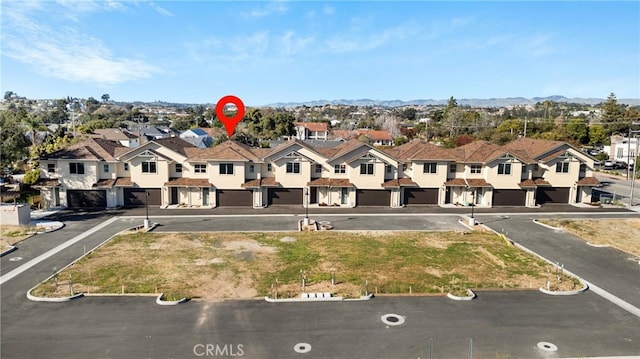 birds eye view of property with a residential view