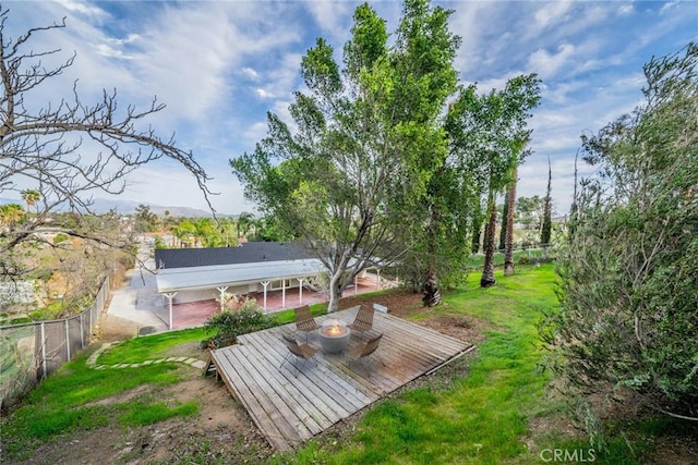 exterior space featuring a fire pit, a patio, and fence