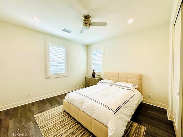 bedroom featuring dark wood-style floors, recessed lighting, visible vents, and baseboards