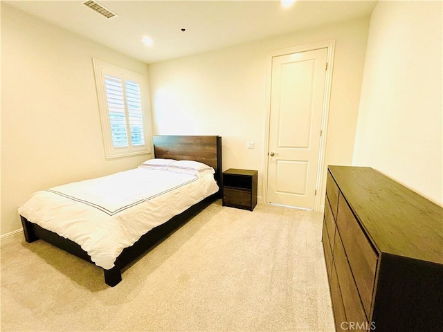 bedroom with light carpet, baseboards, visible vents, and recessed lighting