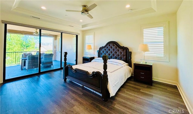 bedroom with recessed lighting, wood finished floors, baseboards, access to outside, and a tray ceiling