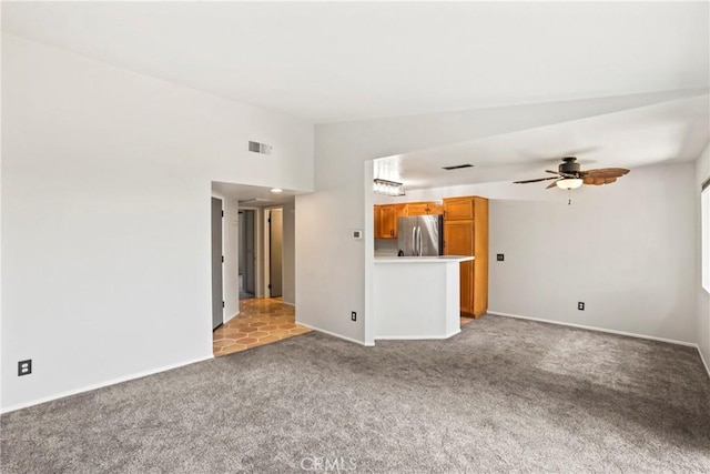 2568 Avenida Del Vis Unit 203, Corona, CA 92882 - unfurnished living room featuring carpet floors, a ceiling fan, and baseboards