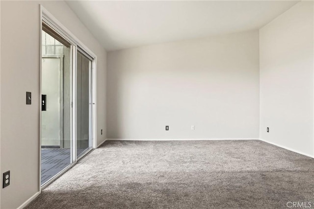 2568 Avenida Del Vis Unit 203, Corona, CA 92882 - unfurnished bedroom featuring carpet floors, baseboards, and access to exterior