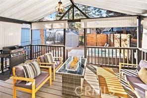 exterior space with a chandelier and vaulted ceiling with beams