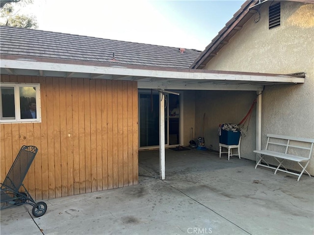 view of property exterior featuring a patio