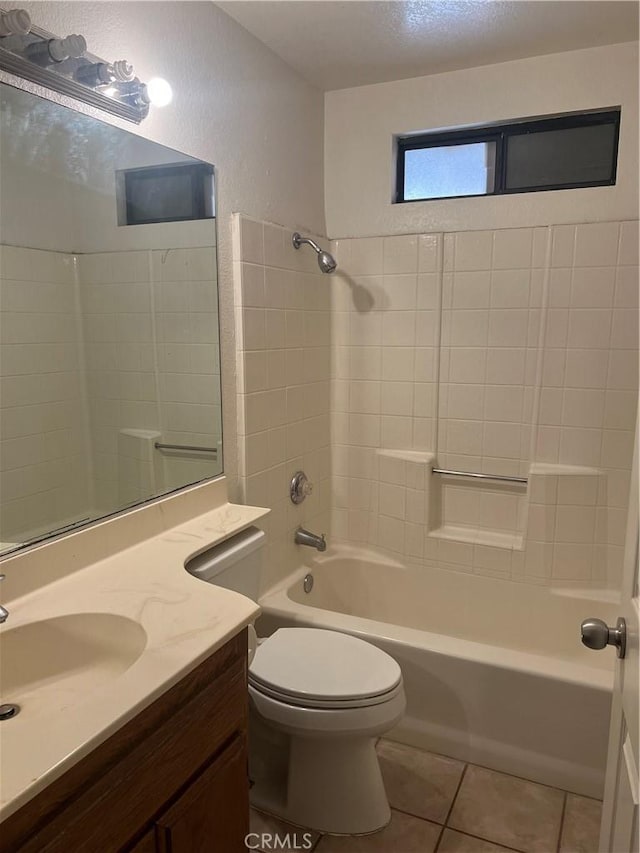 bathroom with tile patterned flooring, shower / bath combination, vanity, and toilet