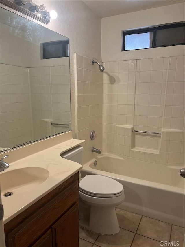 full bathroom with toilet, tile patterned flooring, washtub / shower combination, and vanity