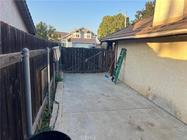 view of patio / terrace with a fenced backyard and a gate