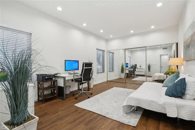 bedroom with recessed lighting, baseboards, and wood finished floors