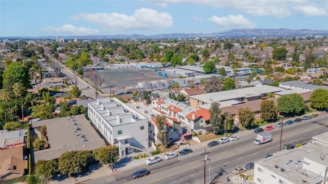 birds eye view of property with a mountain view