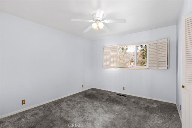 carpeted empty room featuring visible vents, ceiling fan, and baseboards