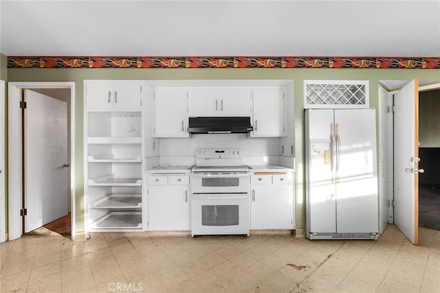 kitchen with under cabinet range hood, white cabinets, stainless steel refrigerator with ice dispenser, double oven range, and light floors