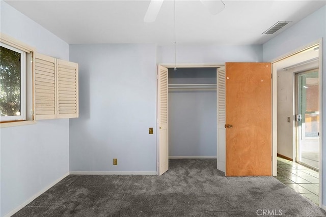 unfurnished bedroom featuring a closet, visible vents, baseboards, and carpet flooring