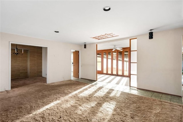 carpeted empty room with ceiling fan