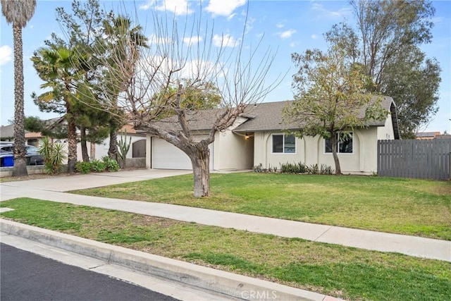 ranch-style house featuring a front lawn, fence, stucco siding, a garage, and driveway