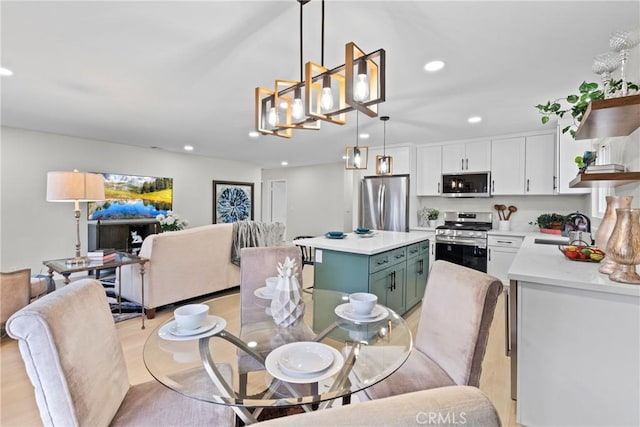 dining area with recessed lighting and light wood-type flooring