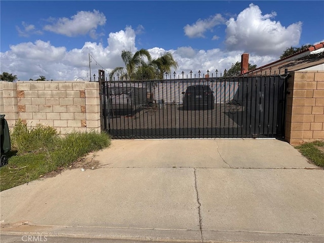 view of gate featuring fence