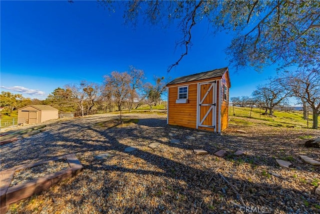 view of shed with fence