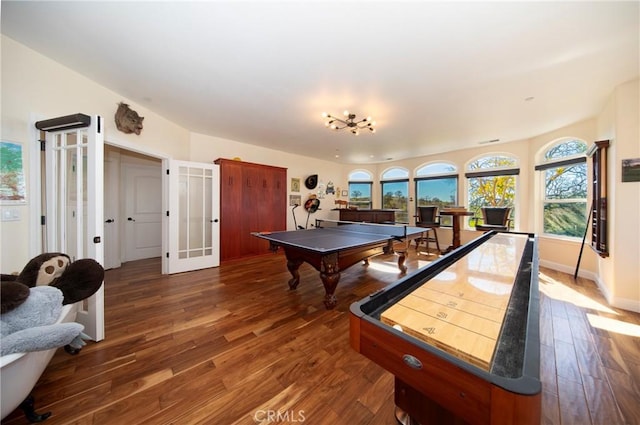 rec room featuring baseboards, wood finished floors, and french doors