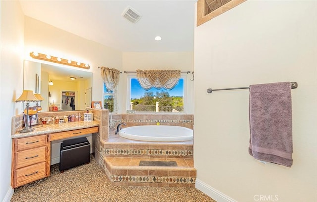 full bathroom featuring visible vents, vanity, and a bath