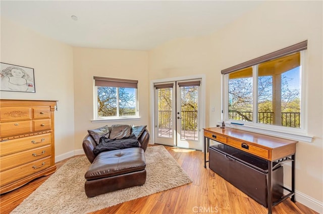 sitting room featuring light wood-style flooring and baseboards