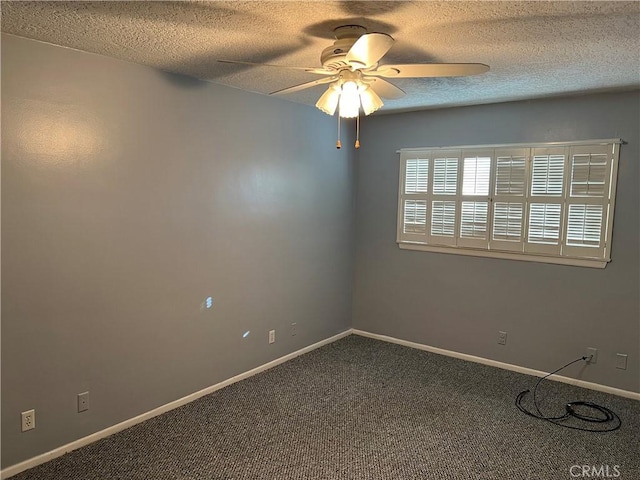 empty room featuring carpet, baseboards, ceiling fan, and a textured ceiling