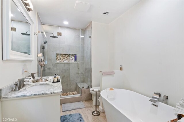4816 Atoll Ave, Sherman Oaks, CA 91423 - full bath featuring wood finished floors, a freestanding tub, vanity, and a stall shower