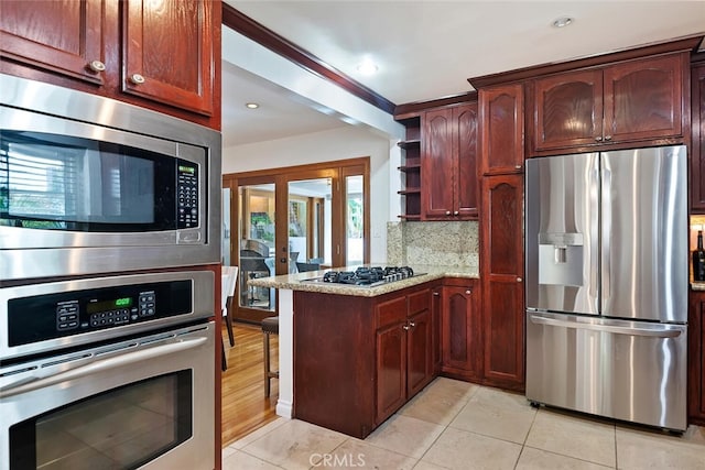 4816 Atoll Ave, Sherman Oaks, CA 91423 - kitchen with stainless steel appliances, open shelves, a peninsula, light tile patterned flooring, and backsplash