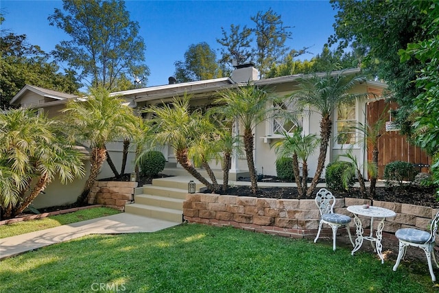 4816 Atoll Ave, Sherman Oaks, CA 91423 - view of front of property with a front yard and a chimney