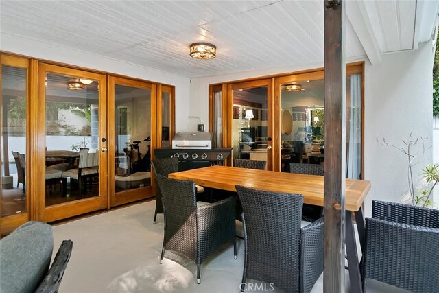 4816 Atoll Ave, Sherman Oaks, CA 91423 - dining space featuring french doors and finished concrete floors