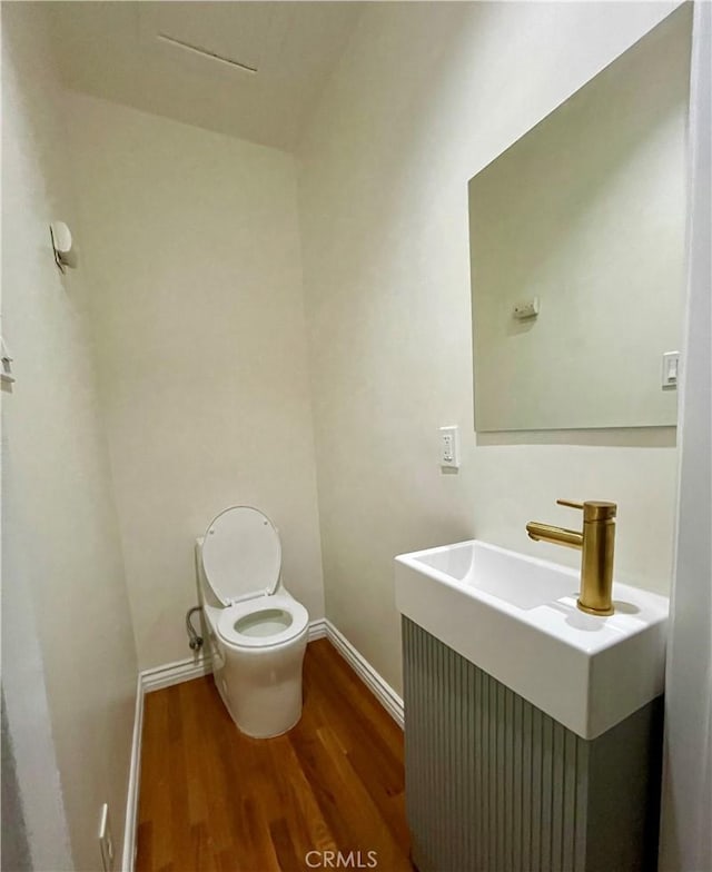 4816 Atoll Ave, Sherman Oaks, CA 91423 - half bath with wood finished floors, baseboards, toilet, and vanity