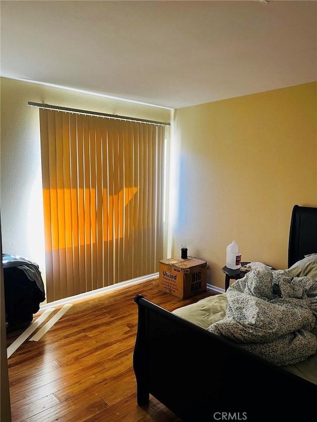 bedroom featuring wood finished floors