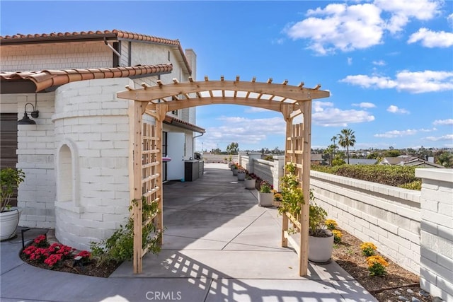 exterior space with fence and a pergola