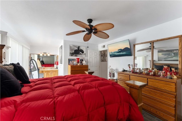 bedroom featuring visible vents and wood finished floors